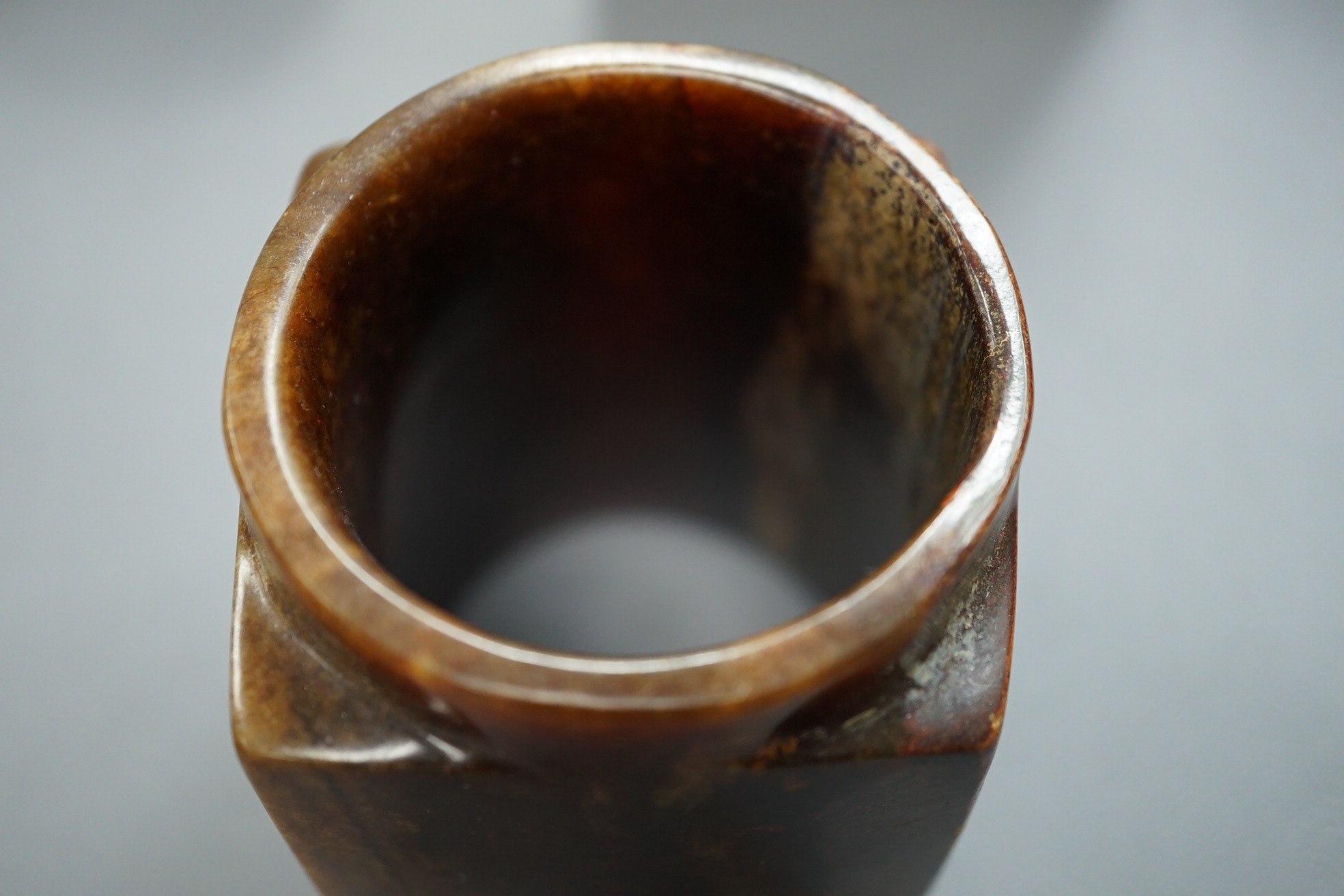 Four Chinese archaistic jade or hardstone cong